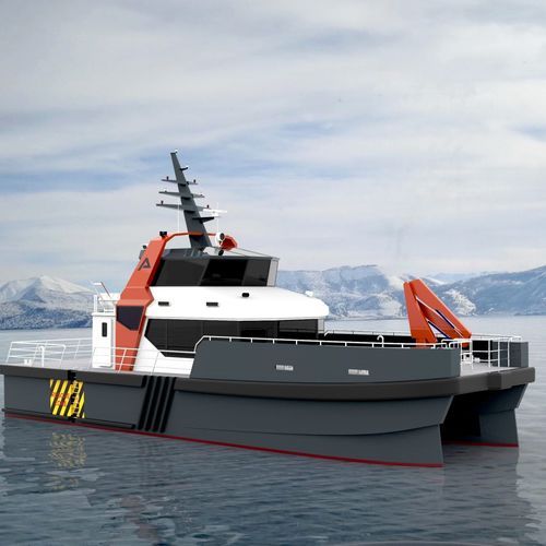 Modern industrial catamaran workboat with orange crane on calm arctic waters.
